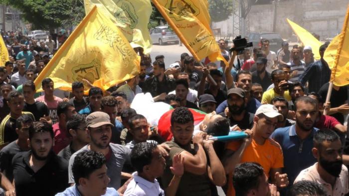 بالصور: كتائب الاقصى "لواء العامودى" تودع شهيدها المقاتل/ محمد شريف بدوان