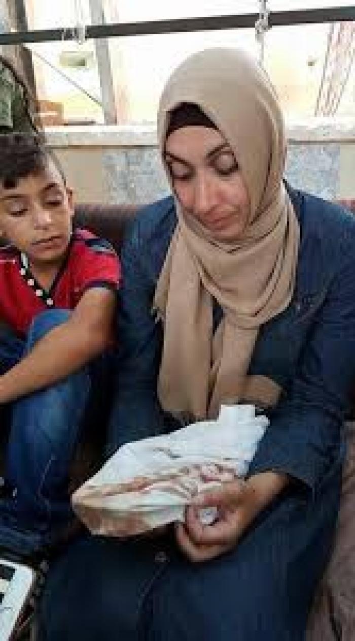 محكمة الاحتلال تمدد اعتقال والدة الشهيد محمد أبو غنام